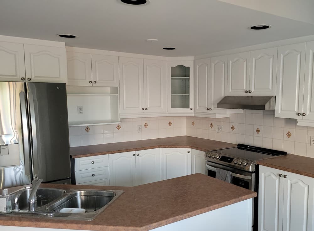 Ottawa kitchen after professional cabinet refinishing - white spray finish