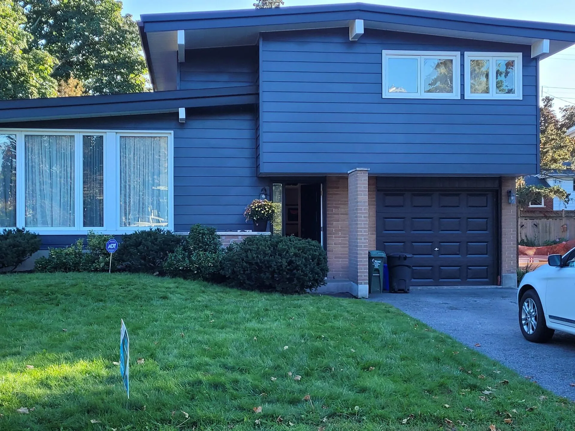 Ottawa home exterior painted blue - real yellow to blue transformation