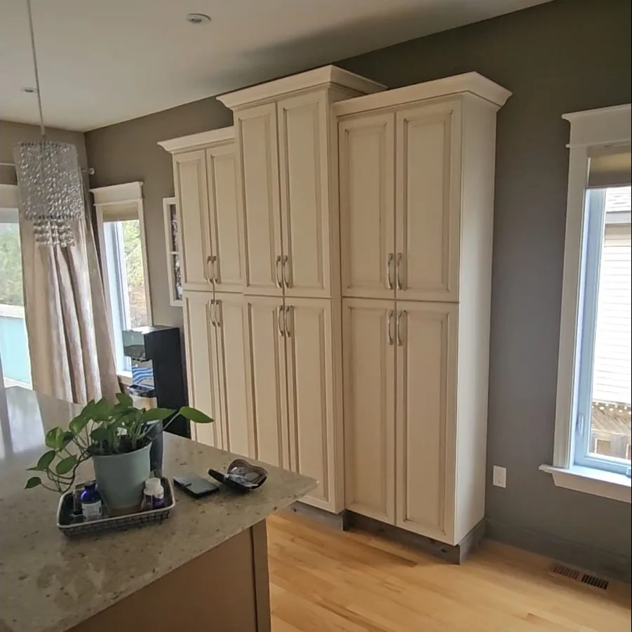 Ottawa kitchen before painting - cream pantry cabinets, taupe island and dark grey walls